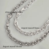 Chaîne argent homme, comparatif visuel entre la maille forçat 5.2 mm en argent massif blanc et la version argent rhodié, montrant la différence de teinte et de brillance.
