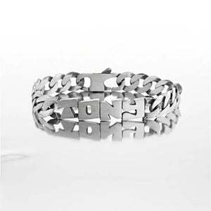 Gourmette homme en Argent 925 massif, maille hawaï 10 mm de large, finition en argent vieilli, prénom découpé main.