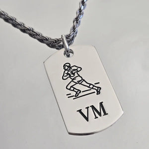 Pendentif homme rugbyman en argent massif.